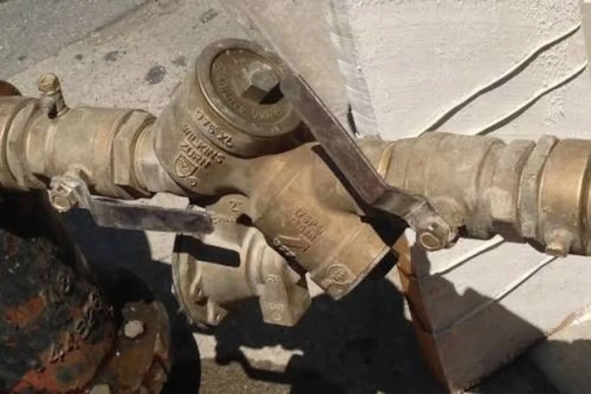 Wrench on a brass backflow assembly